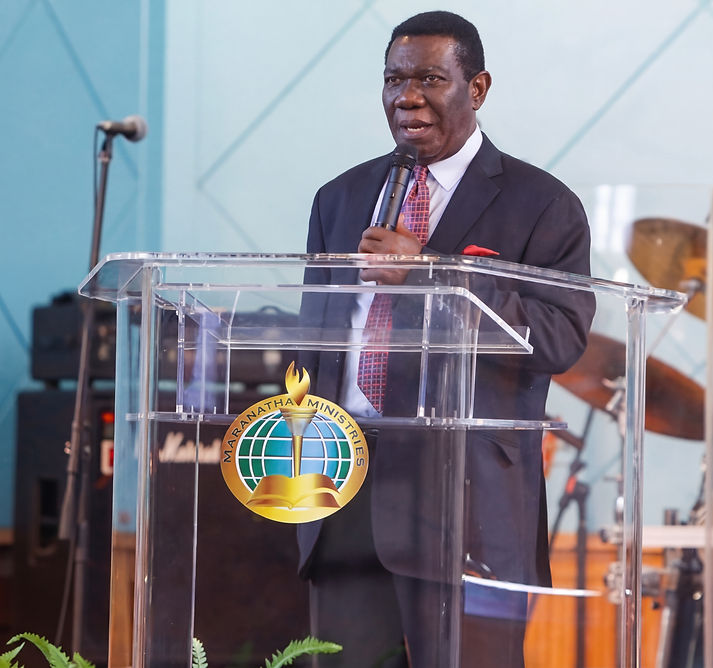 Dr Frederick Mmieh speaking at a lectern